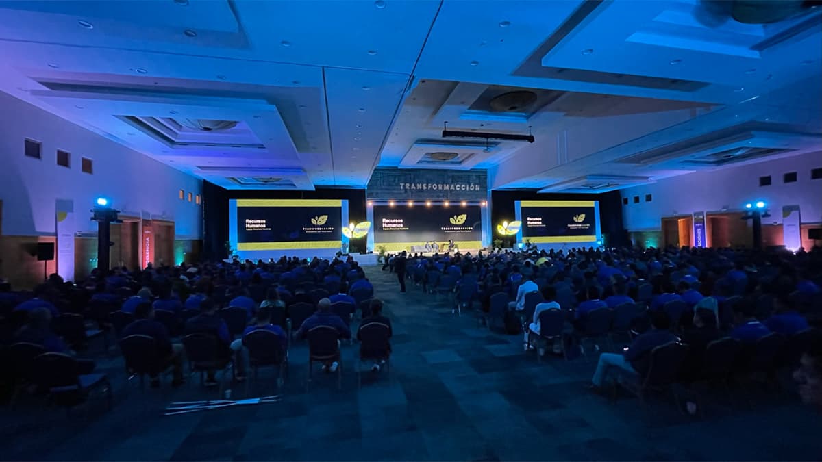 A packed convention hall during a plenary session